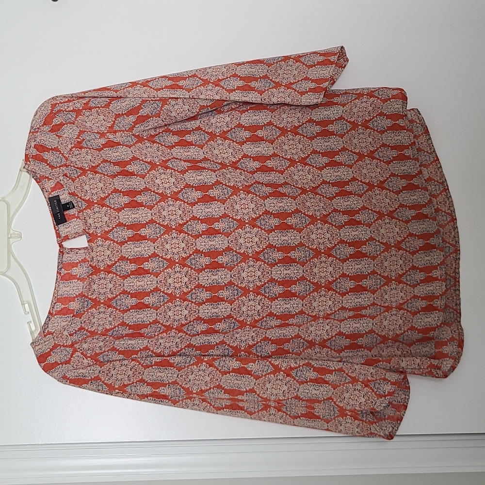 Orange patterned blouse